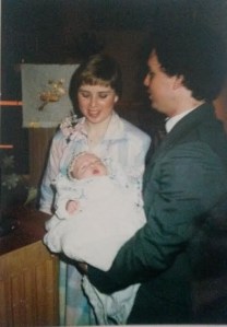 Mom and Dad and me on Easter Sunday by the baptismal font