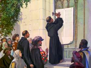 A depiction of Martin Luther nailing his 95 Theses to the Wittenberg Church Door on October 31, 1517