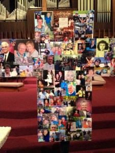 A cross covered in pictures of the "living saints" who are part of a particular faith community's body and congregation.