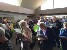 A congregation beginning its procession and walk on Palm Sunday morning 