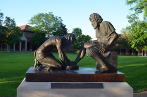 Jesus washing another's feet